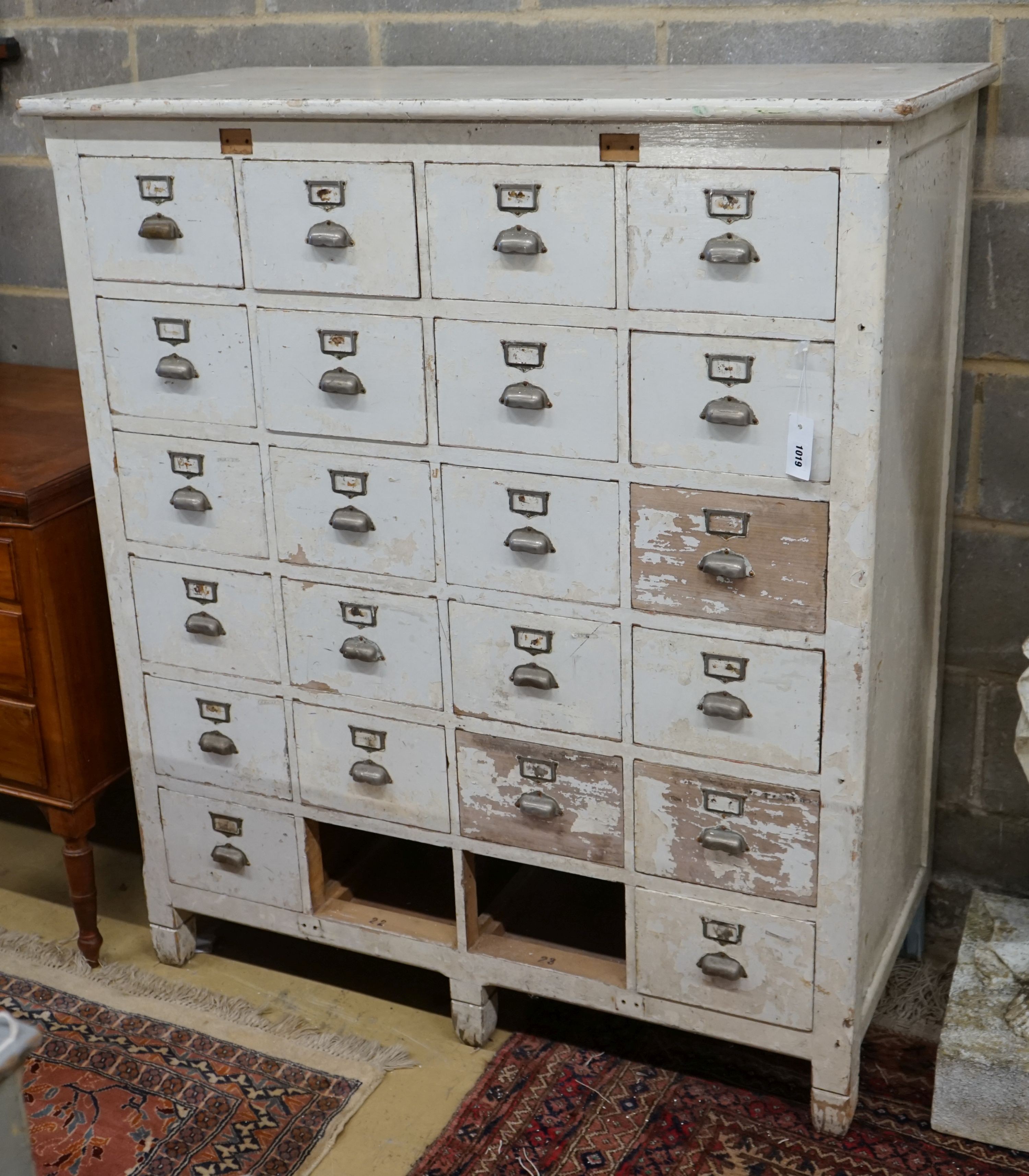 An early 20th century painted beech filing cabinet (lacking two drawers), width 114cm, depth 52cm, height 132cm